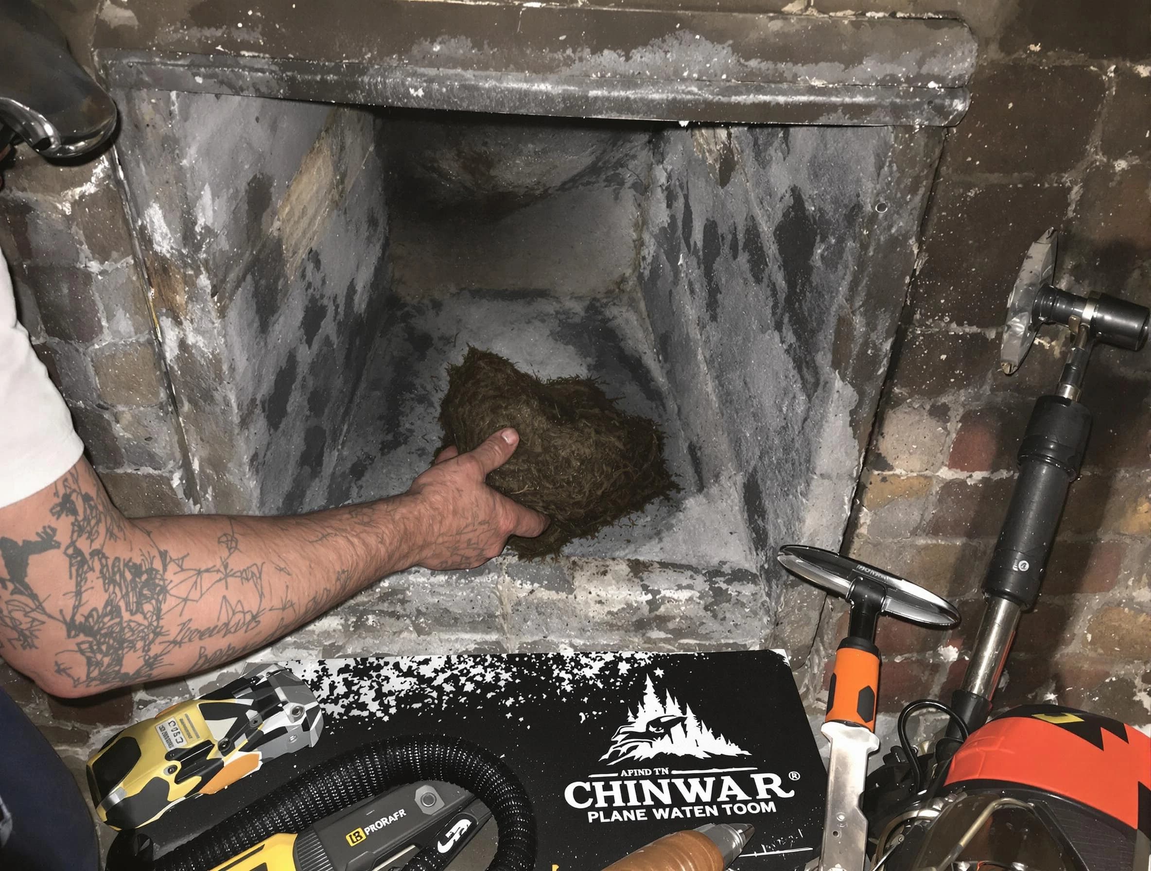 Natick Chimney Sweep safely removing debris and screening chimney in Natick, MA