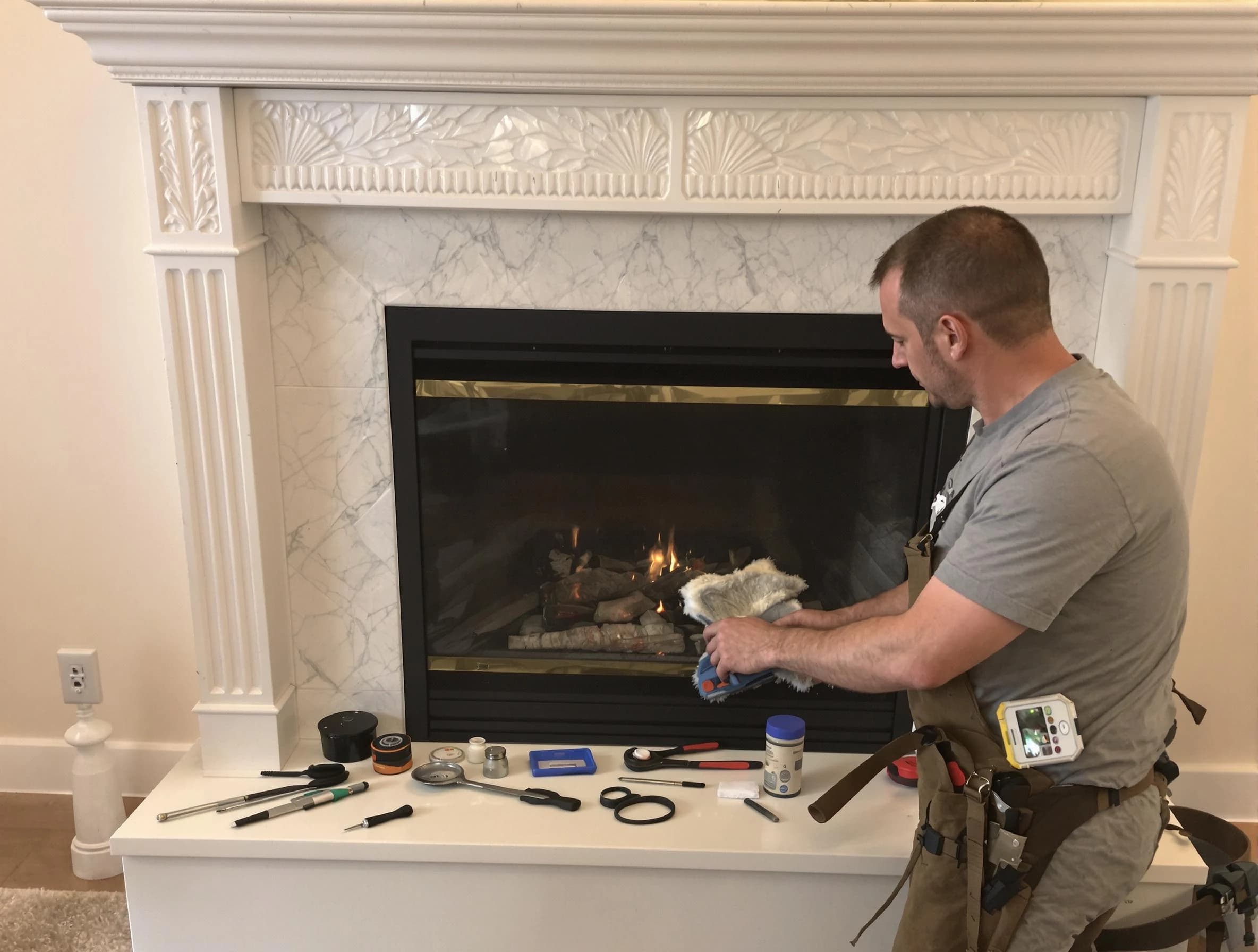 Natick Chimney Sweep performing fireplace maintenance in Natick, MA
